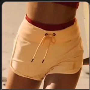 959. FREE PEOPLE Limitless Foldable Shorts in Peach Sz M NWOT $48