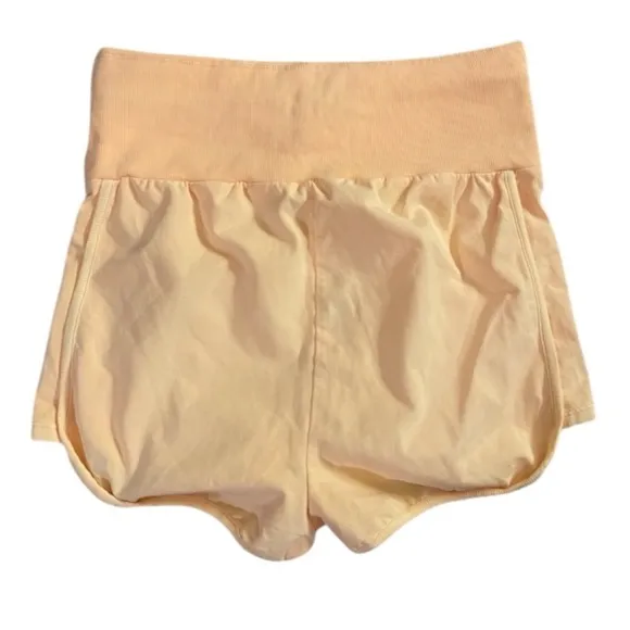 959. FREE PEOPLE Limitless Foldable Shorts in Peach Sz M NWOT $48